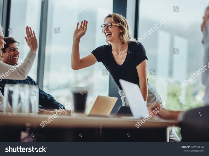 stock-photo-smiling-woman-giving-a-high-five-to-a-female-colleague-in-meeting-business-people-high-five-in-1836592141